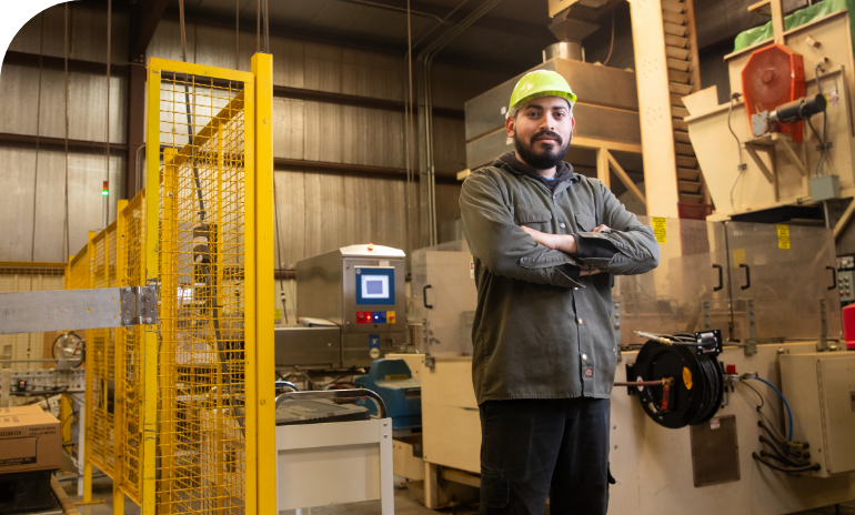 Man at Montpelier huller sheller facility